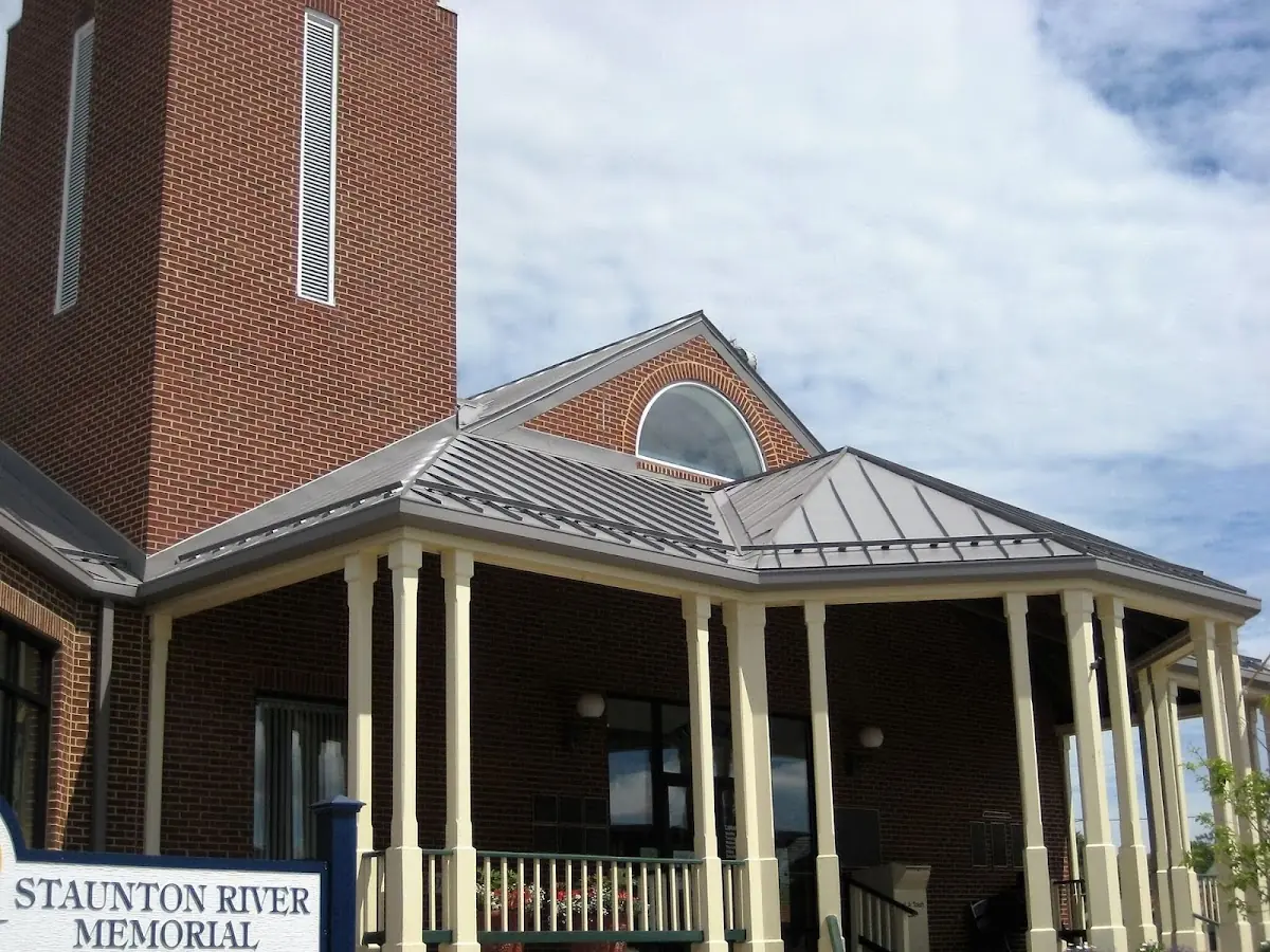 Skilled roofing craftsmen working on a residential roof in Towne Point